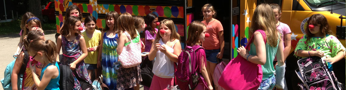 children with clown bus